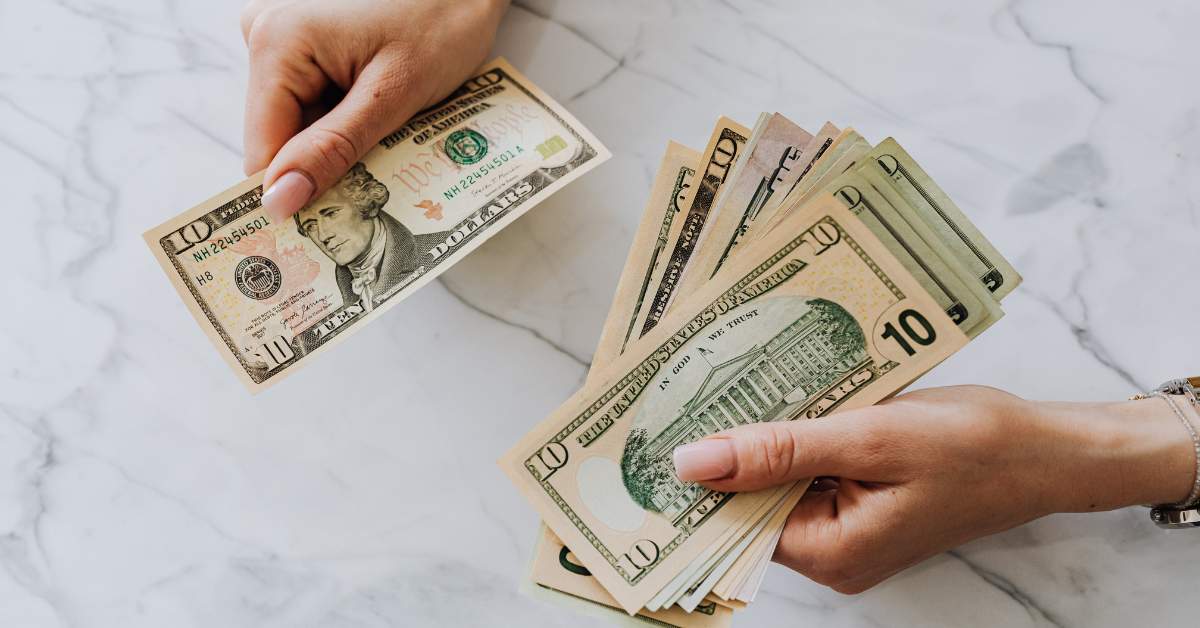 A picture of someone's hands as they count money
