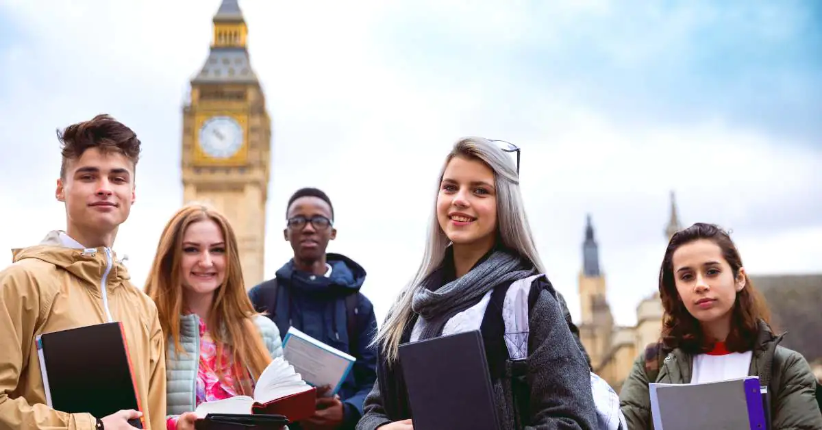 Five college students in London with Big Ben behind them.