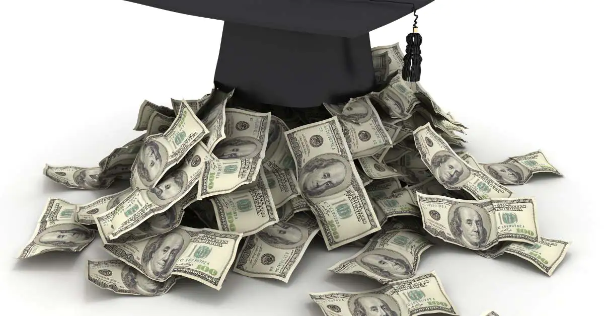 A black graduation cap with money pouring out underneath it.